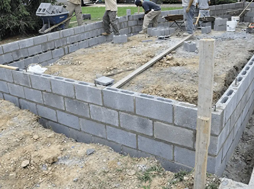 Professionals building a foundation with blocks in San Diego, CA